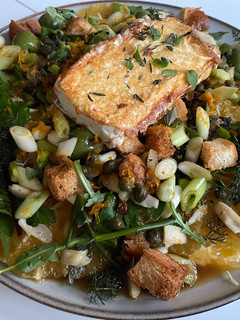 A picture of Lawn Greens and Uniq Fruit Salad.