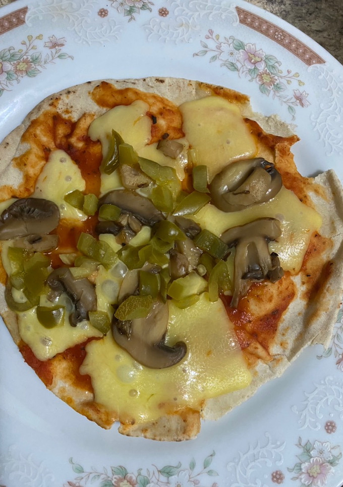 Una foto de Pizza con pan pita