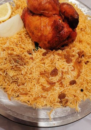 A picture of Tarka pulao with leftover grilled chicken.