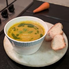 A picture of Dill and carrot soup with fennel oil dressing.