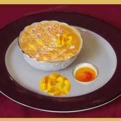 A picture of Sweet Pachadi with ripe mango and jaggery.