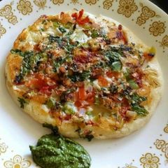 A picture of Tomato Onion Uttapam.