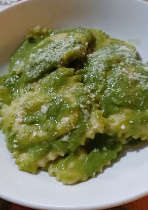 A picture of Ravioli with Goat Ricotta and Pea Cream.