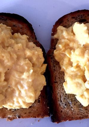 A picture of Scrambled eggs on toast.