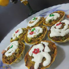A picture of Potato and spinach cup cakes.