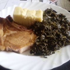 A picture of Ugali with Managu & grilled pork chops.