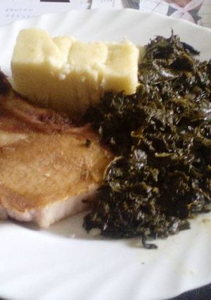A picture of Ugali with Managu & grilled pork chops.