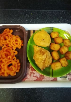 A picture of Potato cheese bite samosa and kachori aloo matar.