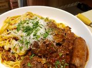 A picture of beef short ribs in red wine