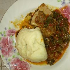 A picture of Pounded yam with vegetable soup.