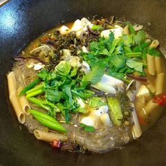 Pickled green and tofu bass soup雪菜豆腐鲈鱼汤 A picture of Pickled green and tofu bass soup雪菜豆腐鲈鱼汤.