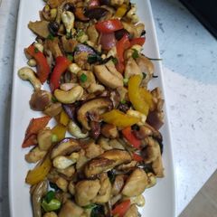 A picture of Fried chicken with basil, cashew nut and mixed mushrooms.