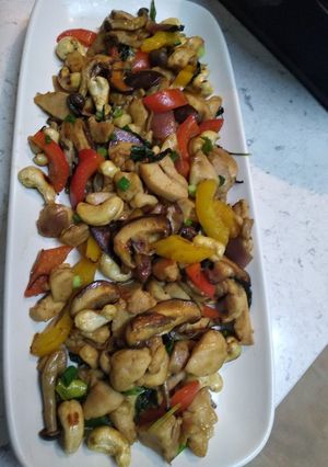 A picture of Fried chicken with basil, cashew nut and mixed mushrooms.