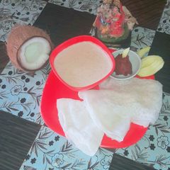 A picture of Neerdose(waterydosa) with sweet coconut milk.