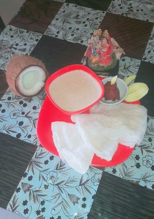A picture of Neerdose(waterydosa) with sweet coconut milk.