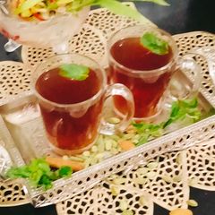 A picture of Basil leaves Ginger Turmeric Herbal Tea ☕☕(Tulsi ginger, turmeric Herbal tea).