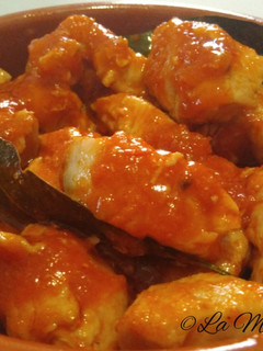 Una foto de Dados de pollo a la cazuela