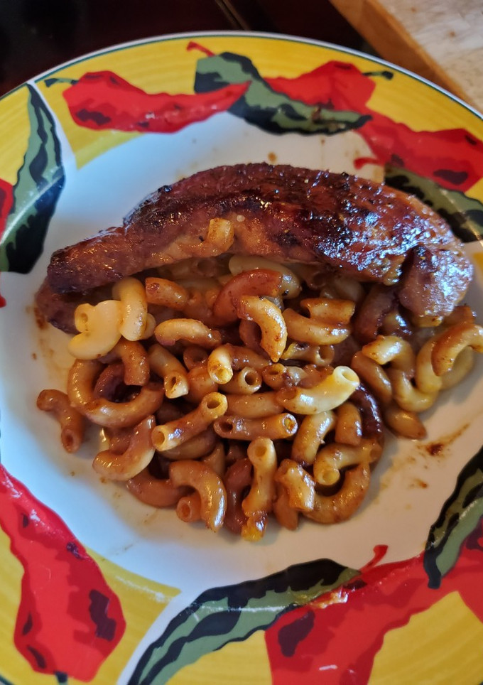 A picture of Mac and cheese stuffed brown sugar/cayenne pork chop.