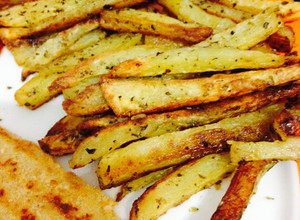Una foto de Papas al horno con orégano