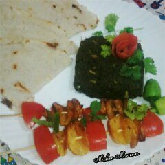 A picture of Sarsoon ka saag with chawal ki rotti.