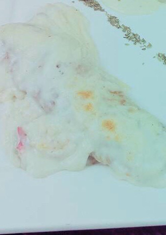 Una foto de Canelones de acelga, ricota y nuez con salsa blanca