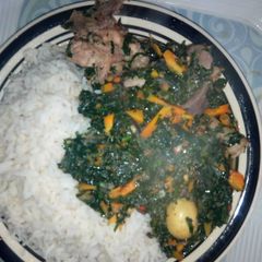 A picture of White rice and vegetable sauce.