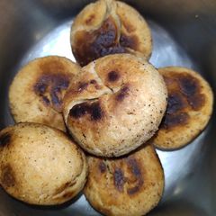 A picture of Steamed Bati in Cooker.