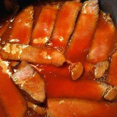 A picture of Buttery London Broil with Slobber Knocker sauce.
