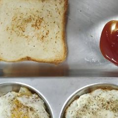 A picture of Bread with half fry Egg.
