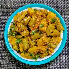 A picture of Turai(Ridge gourd) Posto(Poppy seeds).