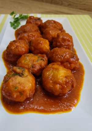 A picture of Meatballs in Onion and Tomato Sauce.