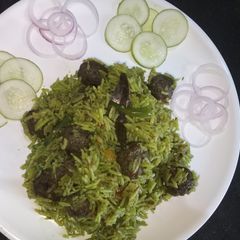 A picture of Spinach rice with nutrella balls.
