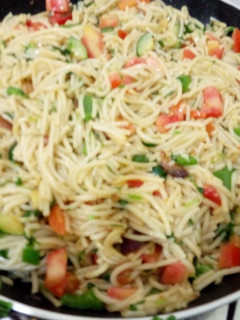 A picture of Spaghetti with vegetables.