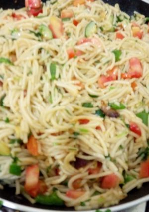 A picture of Spaghetti with vegetables.