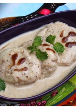 A picture of Dahi Bhalay - Pakistani style Fried Lentil Cakes in Sweet Yogurt Sauce.