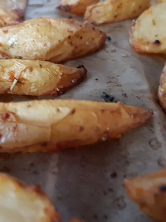 Una foto de Patatas en gajos al horno