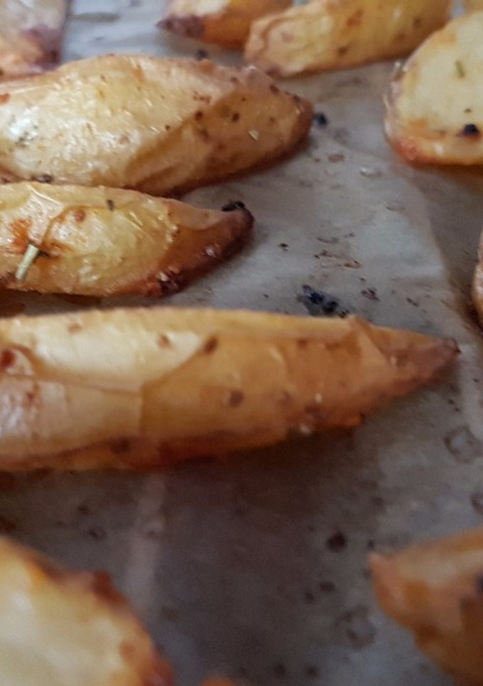 Una foto de Patatas en gajos al horno