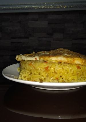 A picture of Noodles and omelette.