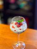 Coconut and berries pudding with sago tapioca balls