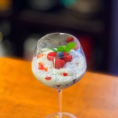 A picture of Coconut and berries pudding with sago tapioca balls.