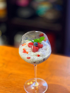 A picture of Coconut and berries pudding with sago tapioca balls.