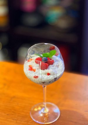 A picture of Coconut and berries pudding with sago tapioca balls.
