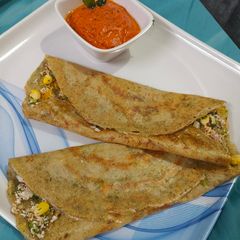 A picture of Protein rich healthy mix dal dosa with tangy tomato chutney.