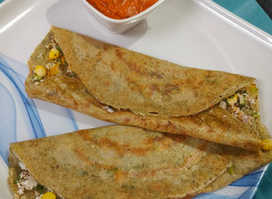 A picture of Protein rich healthy mix dal dosa with tangy tomato chutney.