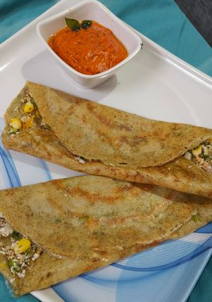 A picture of Protein rich healthy mix dal dosa with tangy tomato chutney.