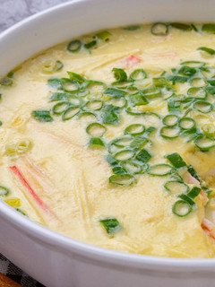 A picture of #132 Steamed Egg with Imitation Crab Sticks.