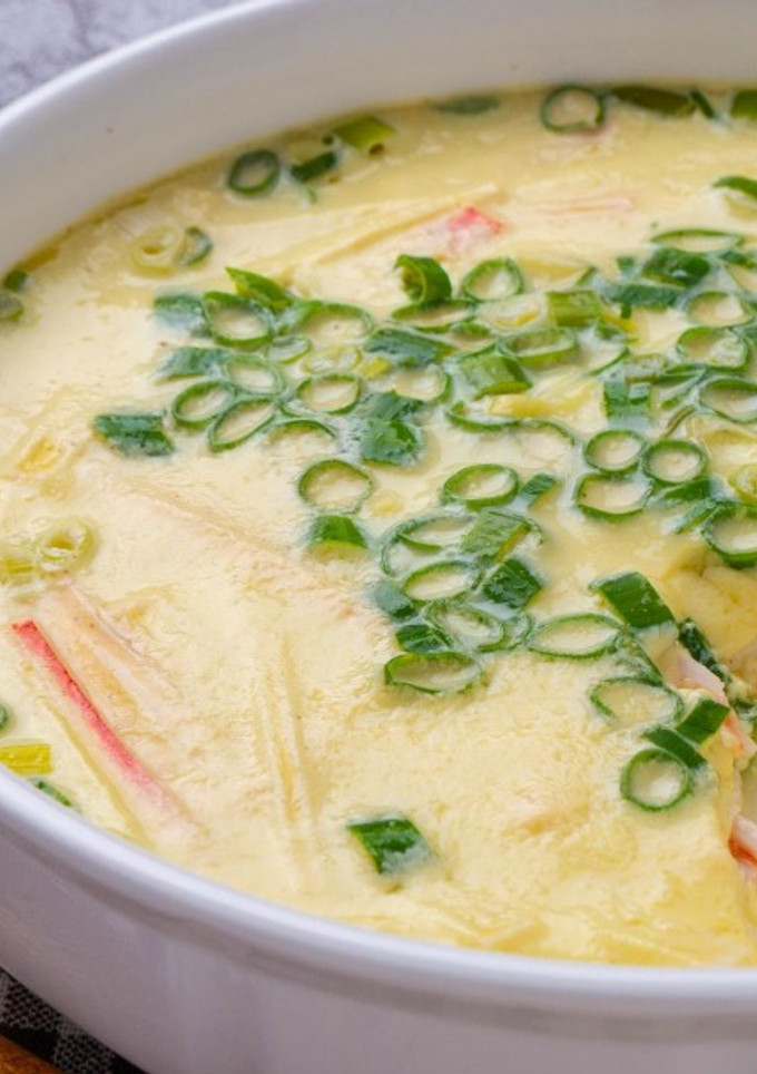 A picture of #132 Steamed Egg with Imitation Crab Sticks.