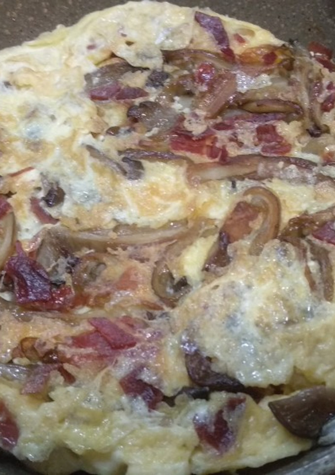 Una foto de Tortilla de setas y jamón