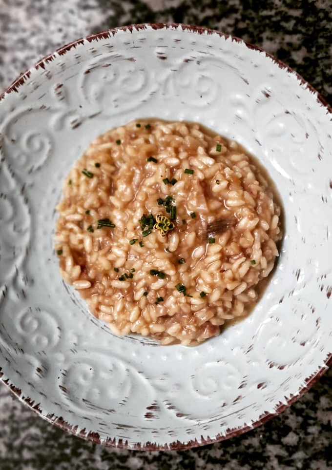 Una foto de Risotto de pies de cerdo y boletus