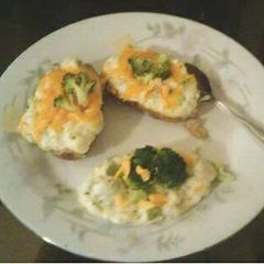 A picture of Broccoli and cheddar cheese twice baked potato.
